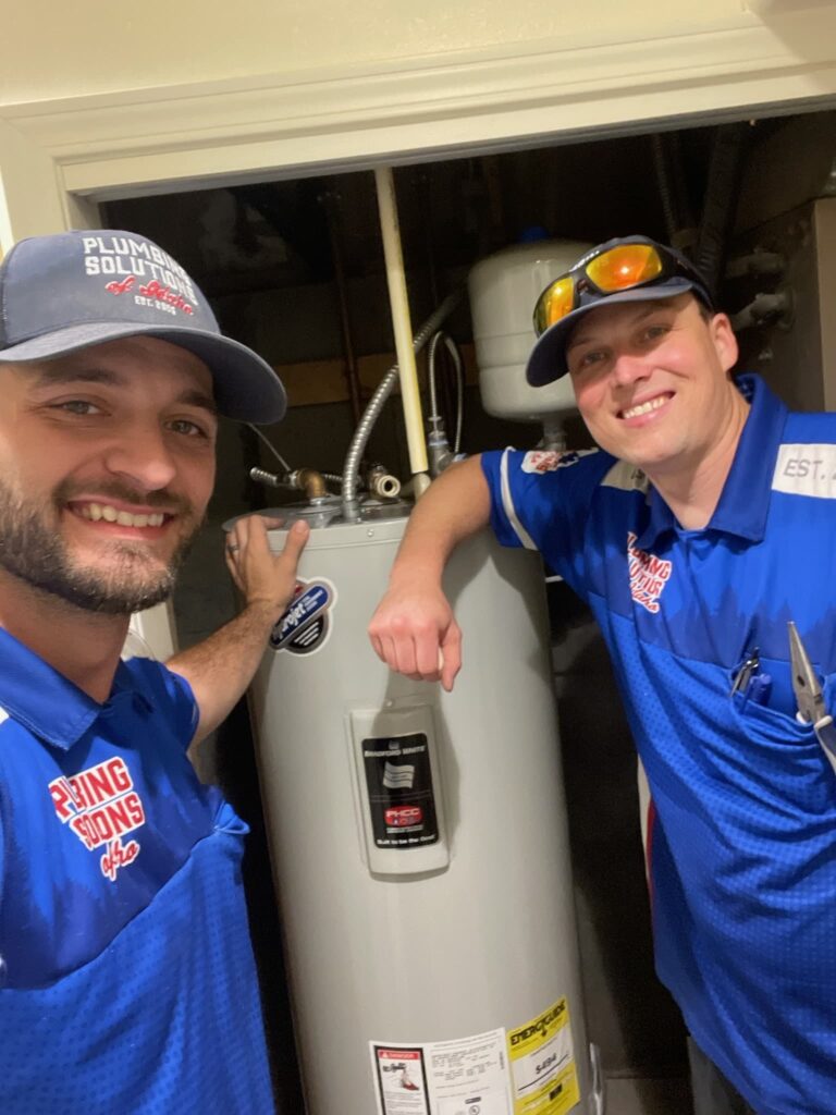 Two employee's finished water heater installation in Boise, ID