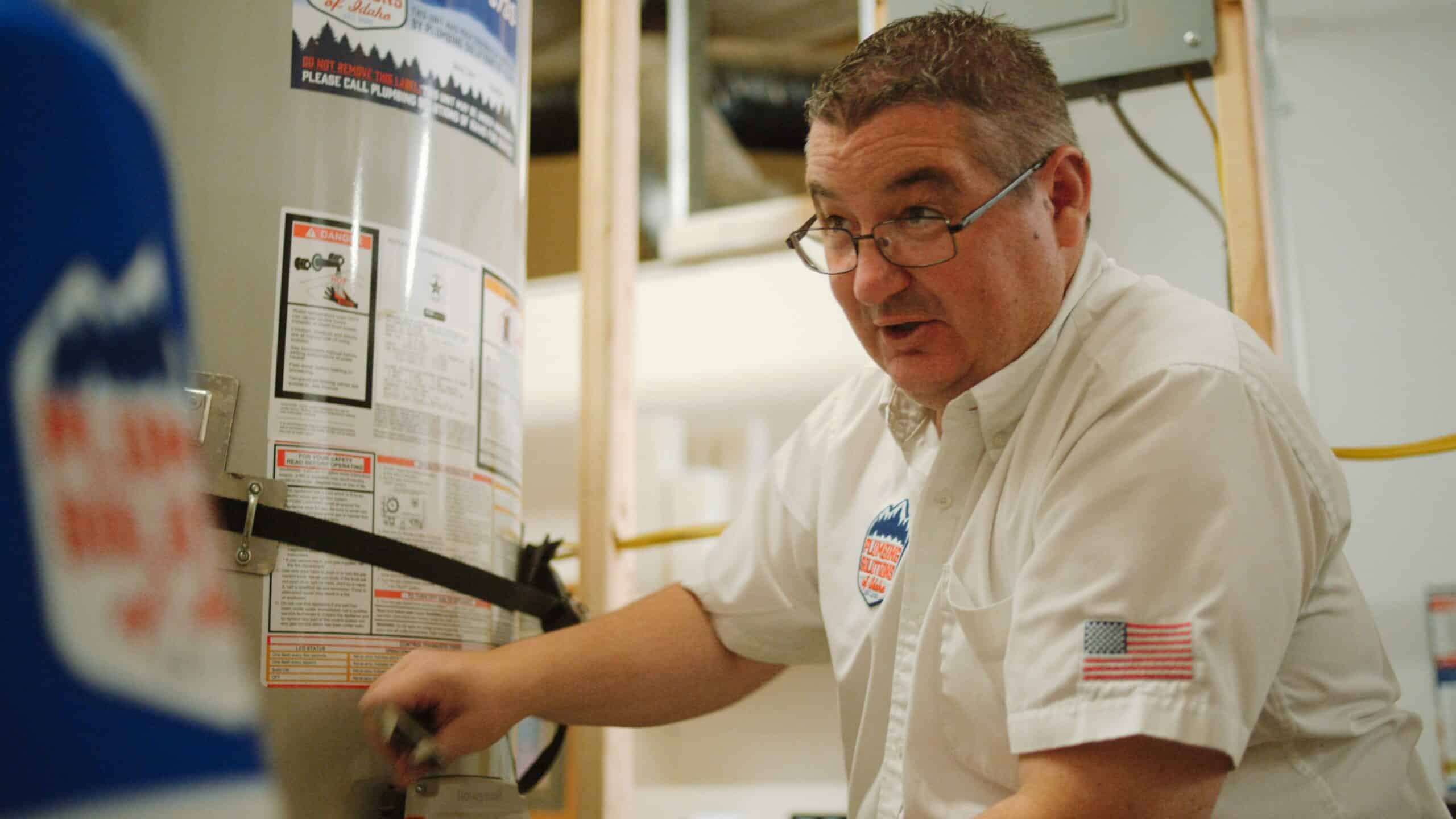 Employee working on water heater installation in Boise, ID